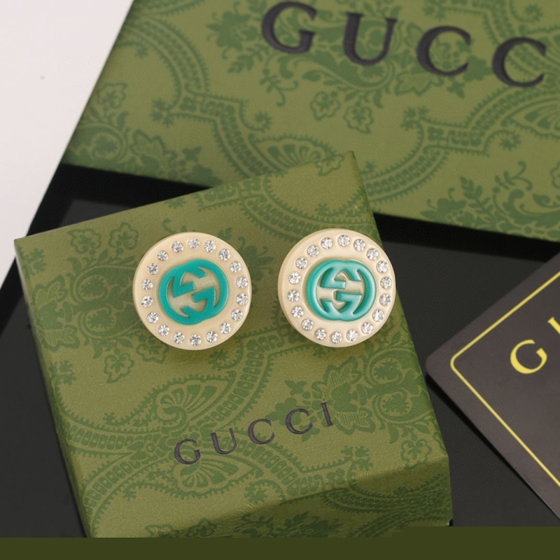 G*u*i earrings